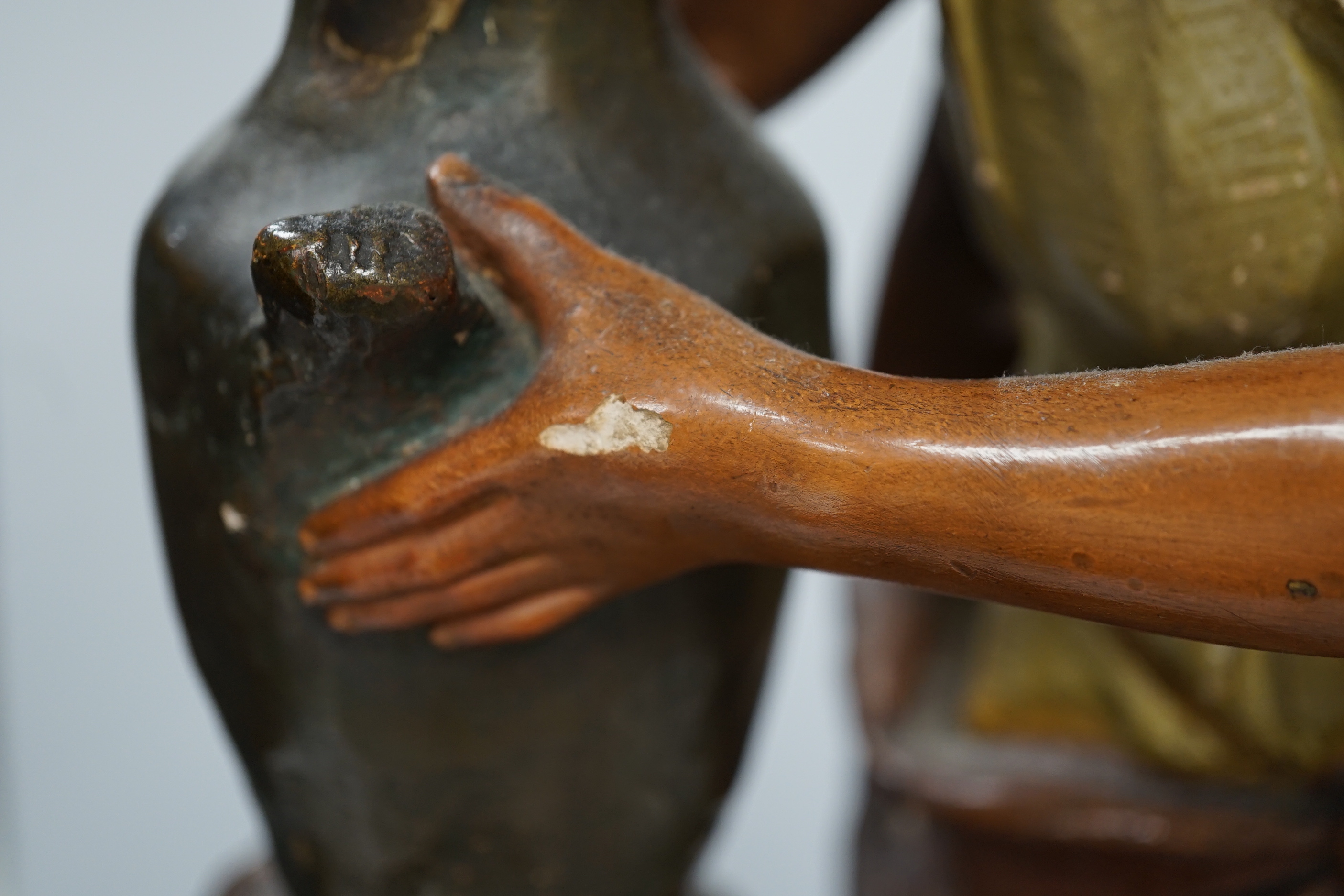 A painted plaster figure of Rebecca at the well, 58cm high